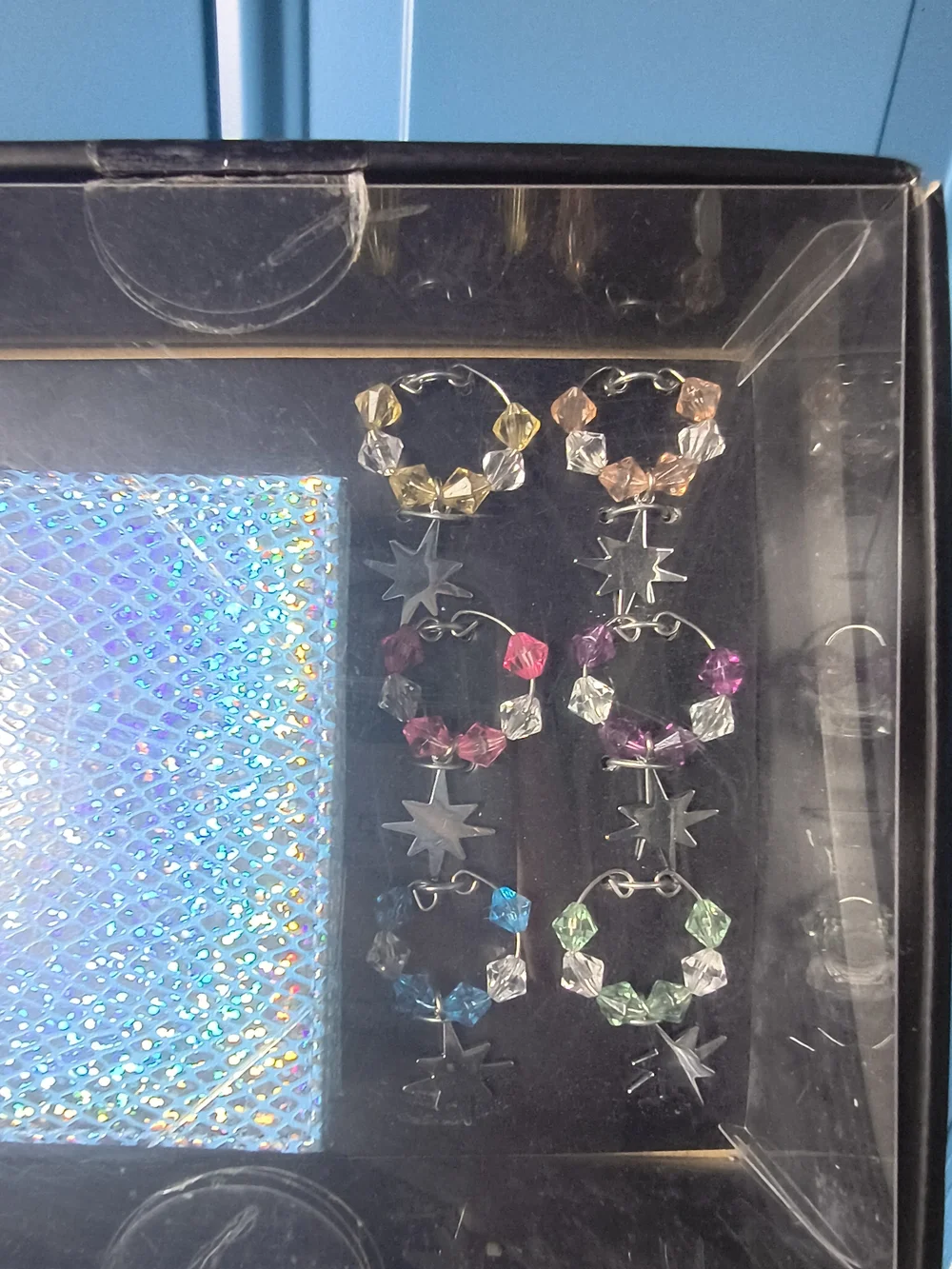 bebe Iridescent Blue Card Case with Multicolor Crystal Hoop Earrings